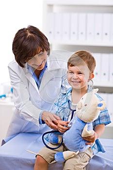 Doctor examining child