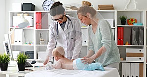 Doctor examining a child boy in a hospital