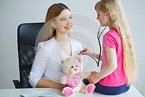 Doctor examining a child girl in a hospital