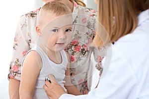 Doctor examining a child patient by stethoscope
