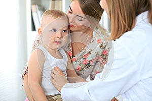 Doctor examining a child patient by stethoscope
