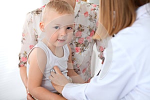 Doctor examining a child patient by stethoscope