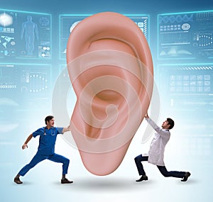 Doctor examining giant ear in medical concept