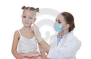 Doctor examining girl with chickenpox on background. Varicella zoster virus