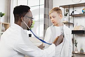 Doctor examining health with stethoscope of little boy