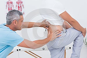 Doctor examining his patient back