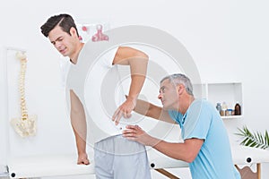 Doctor examining his patient back