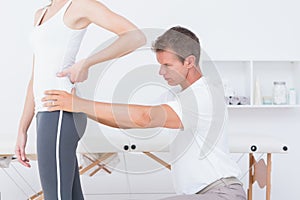 Doctor examining his patient back