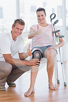 Doctor examining his patient knee