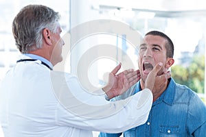 Doctor examining his patients ganglion photo