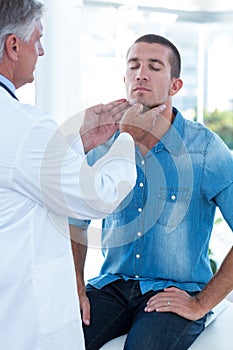 Doctor examining his patients ganglion photo
