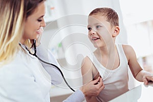 Doctor examining a little boyl by stethoscope