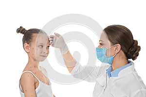 Doctor examining little girl with chickenpox on background. Varicella zoster virus