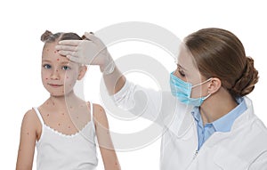 Doctor examining little girl with chickenpox on background. Varicella zoster virus