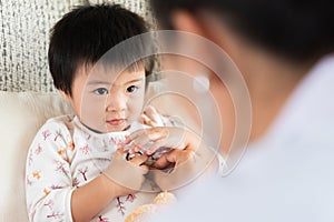 Doctor examining a little girl by using stethoscope. Medicine an