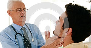 Doctor examining male patient