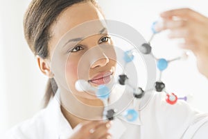 Doctor Examining Molecular Structure In Laboratory