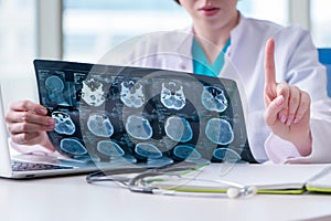 The doctor examining mri image in hospital