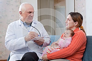 Doctor examining newborn baby