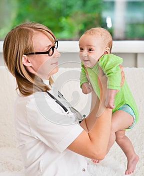 Doctor examining a newborn baby