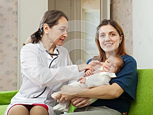 Doctor examining newborn baby