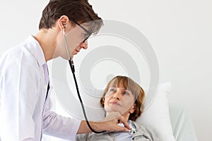 The doctor is examining the patient in the hospital