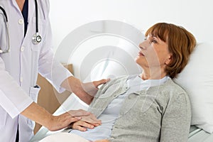 The doctor is examining the patient in the hospital