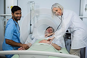 Doctor and examining a patient in hospital