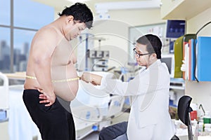 Doctor examining a patient obesity 1