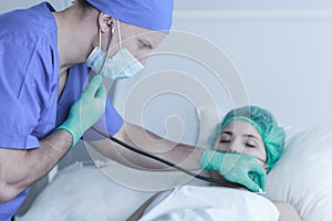 Doctor examining patient after operation