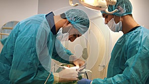 Doctor examining a patient with a retractor in the dental office