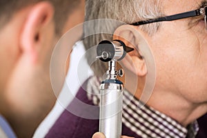 Doctor Examining Patient's Ear