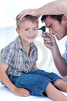 Doctor examining a patient' s ears