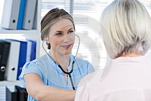 Doctor examining a patient with stethoscope