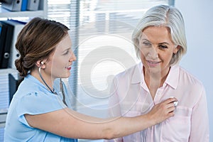 Doctor examining a patient with stethoscope