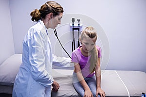 Doctor examining a patient with stethoscope