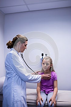 Doctor examining a patient with stethoscope