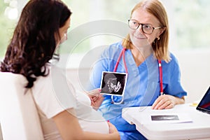 Doctor examining pregnant woman. Pregnancy check