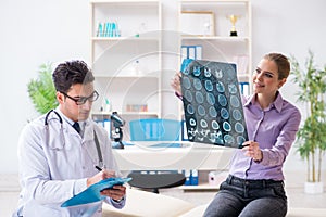 The doctor examining x-ray images of patient