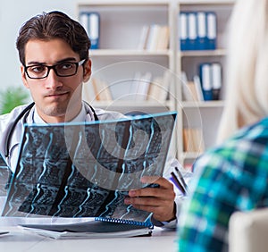 Doctor examining x-ray images of patient