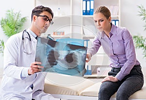 Doctor examining x-ray images of patient