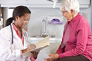 Doctor Examining Senior Female Patient