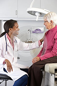 Doctor Examining Senior Female Patient