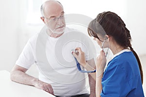 Doctor Examining Senior Patient