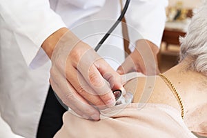 Doctor examining a senior woman