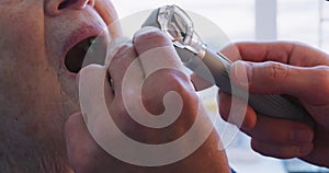 Doctor examining a senior woman in a retirement home