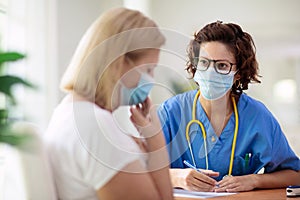 Doctor examining sick patient. Ill woman in clinic