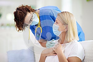 Doctor examining sick patient. Ill woman in clinic