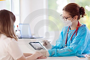 Doctor examining sick patient. Ill woman in clinic