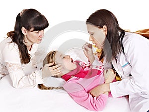 Doctor exams child with stethoscope. photo